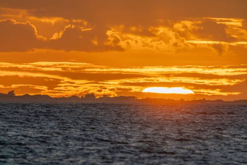 Paisagem do pôr de sol na Praia de Tourinhos - Polo Costa das Dunas